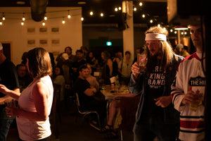 People enjoying Candid vegan lager and low gluten beer