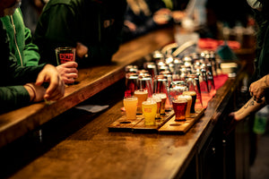 One of the best breweries in Nova Scotia. Image of a bar with low gluten lagers, vegan beer, hoppy beer being served. 