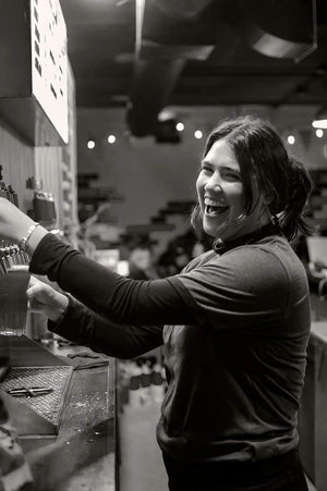 Woman serving beer