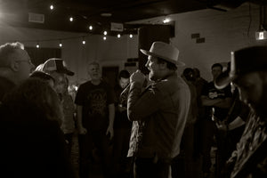 The Fabulously Rich singing. Black and white image. 