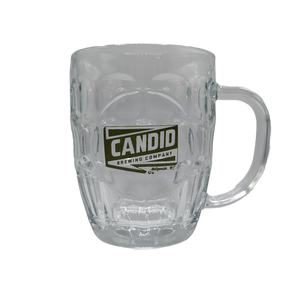 An empty, clear Candid branded stein. 